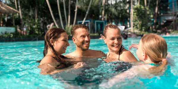 A family is playing in the water